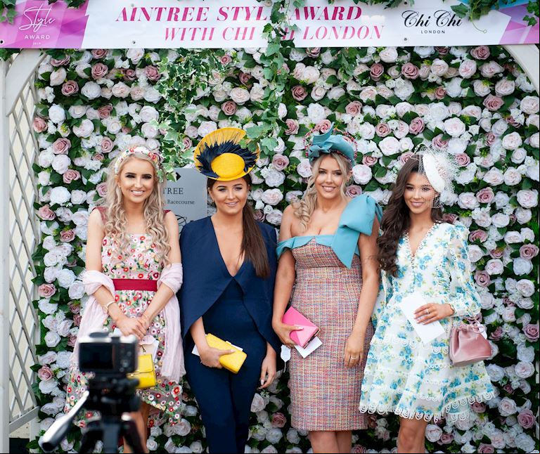Four females against flower wall 2019.jpg